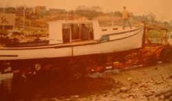 Pulling the boat out of the water to take it home for re-modeling.